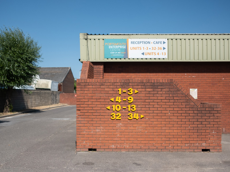 Outside view of a wall with the PEC unit numbers on it.