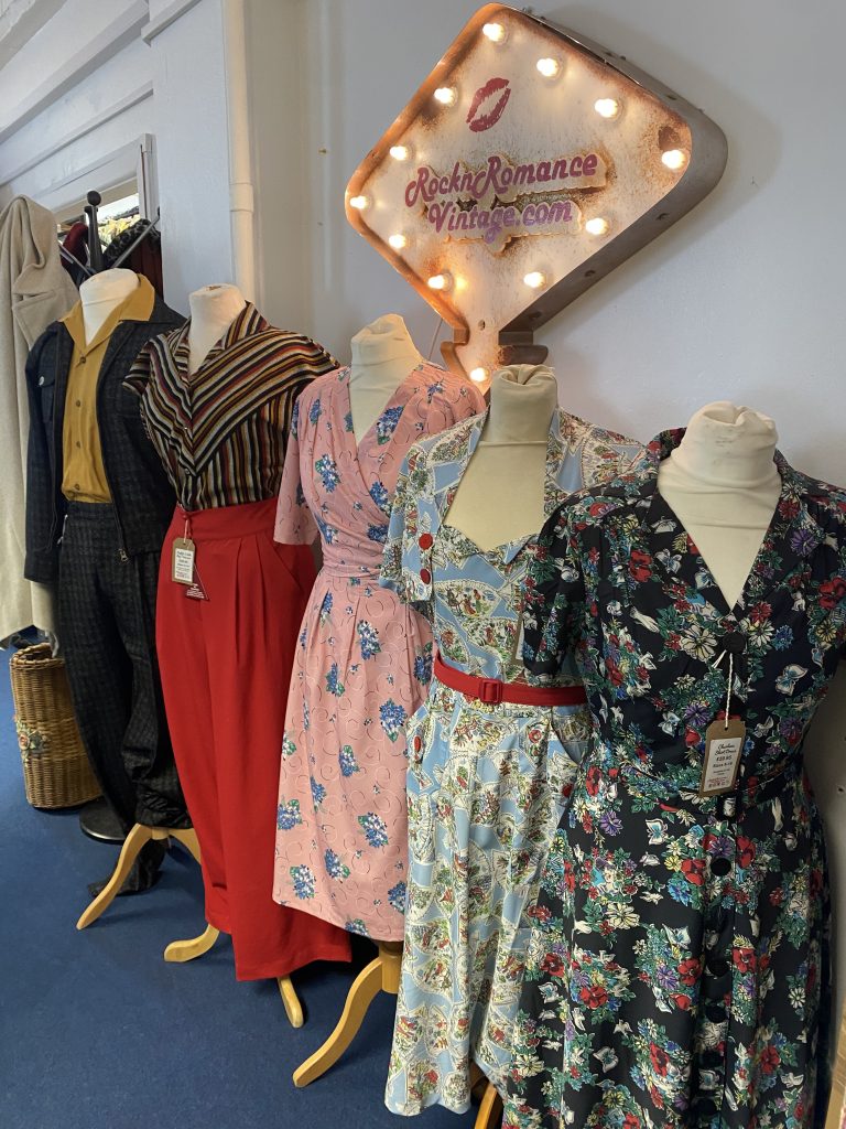 Range of vintage dresses on display