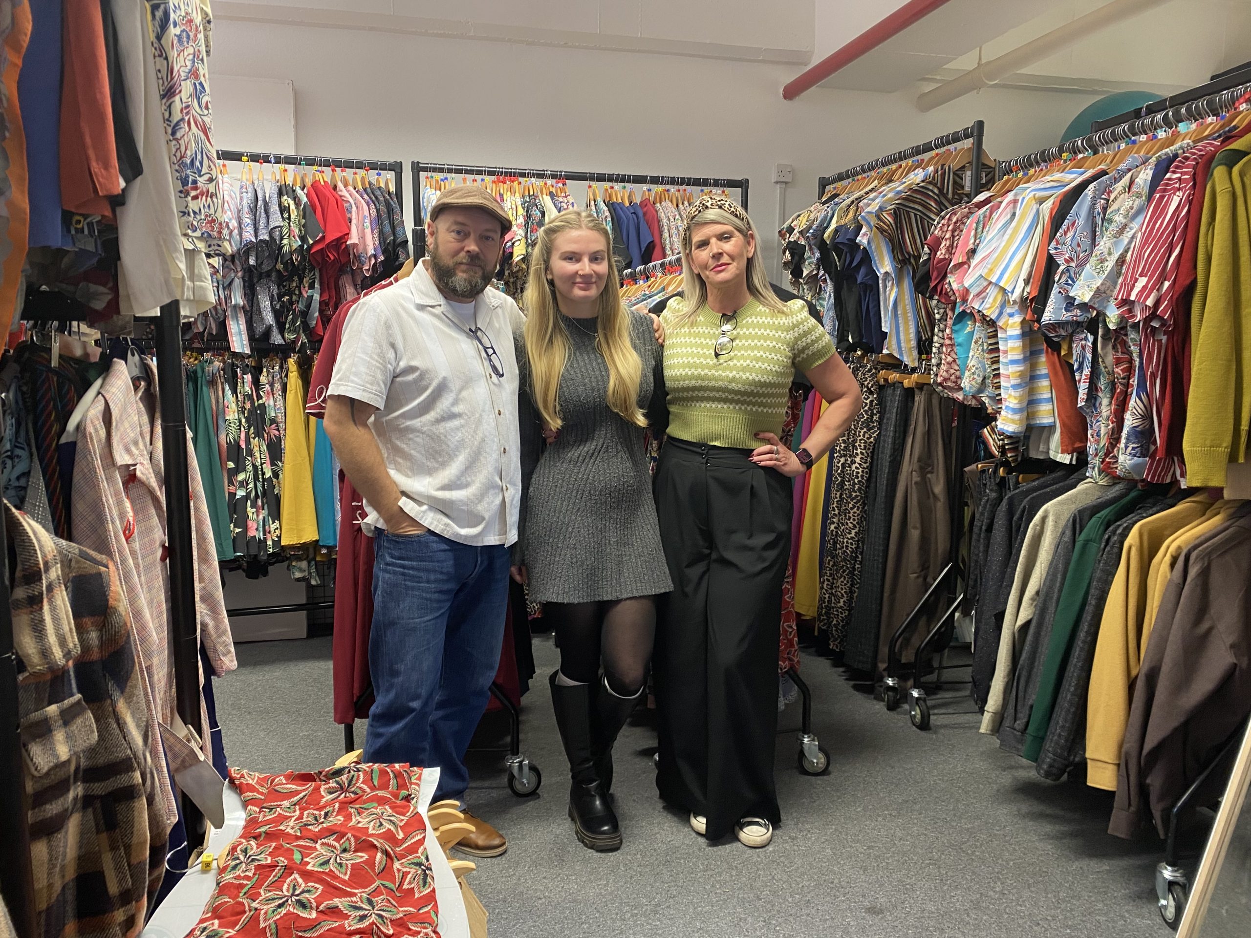Rock n Romance owners with rails of clothing